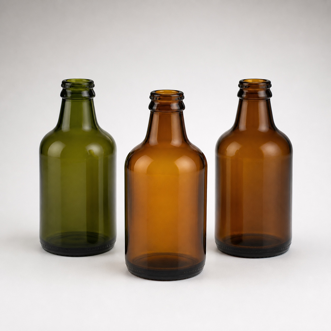 Unbranded amber and green stubby glass beer bottles