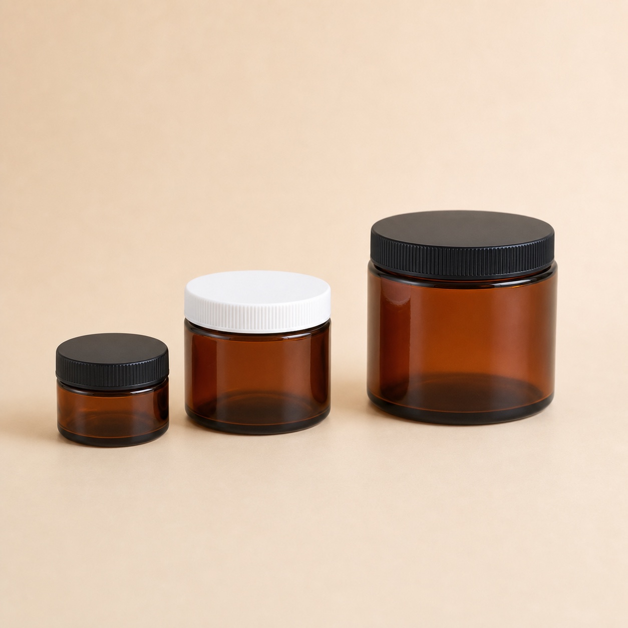 Unbranded amber glass ointment jar family with screw caps