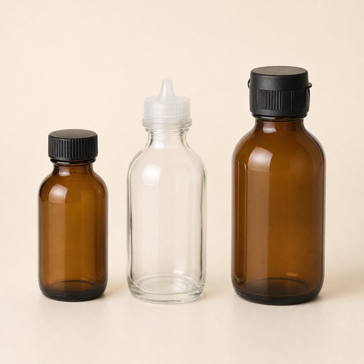 Unbranded amber and clear round glass syrup bottles